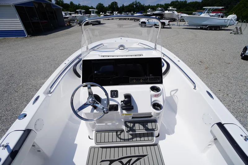 Slide: The Image of 2025 Tidewater 198 CC Adventure boat interior with steering wheel and control panel. - 19