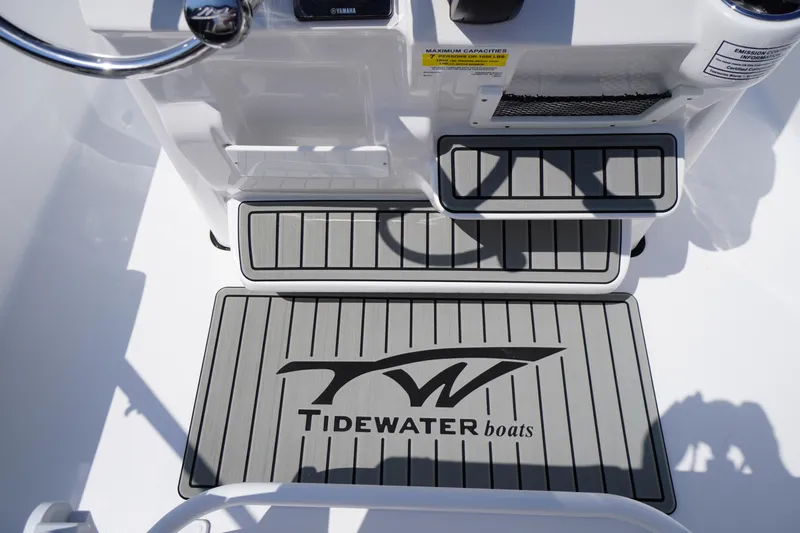 Slide: The Image of 2025 Tidewater 198 CC Adventure boat deck with logo and non-slip flooring. - 28