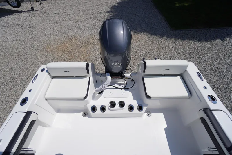 Slide: The Image of 2025 Tidewater 198 CC Adventure boat, rear view with engine and seating. - 34