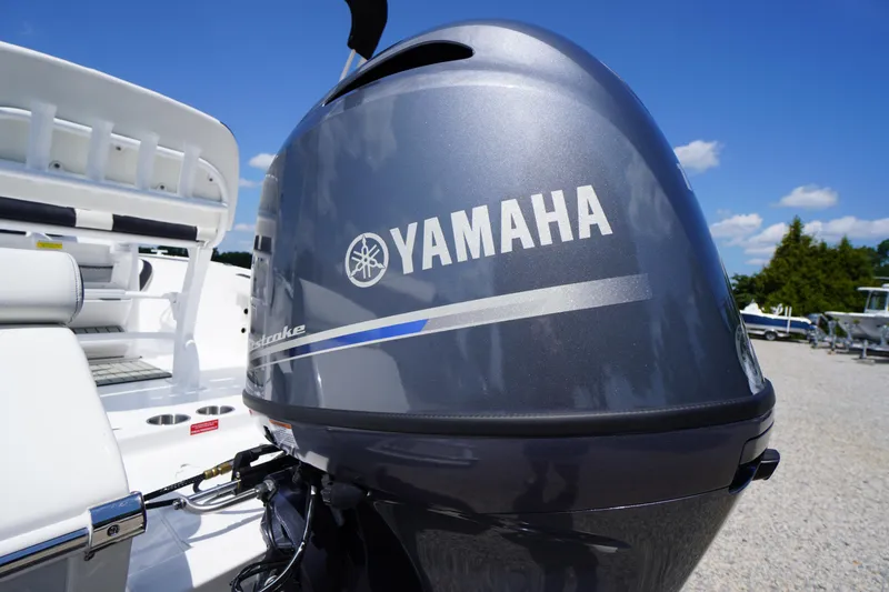 Slide: The Image of Yamaha outboard motor on 2025 Tidewater 198 CC Adventure boat under clear blue sky. - 42