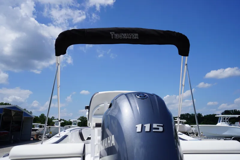 Slide: The Image of 2025 Tidewater 198 CC Adventure boat with Yamaha 115 engine under clear blue sky. - 46