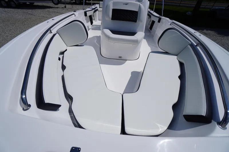 Slide: The Image of 2025 Tidewater 198 CC Adventure boat interior with white cushioned seating. - 7