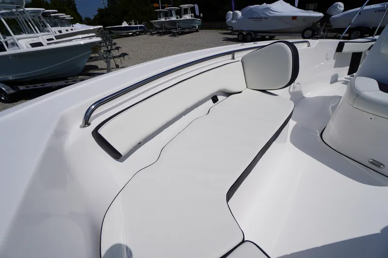 Slide: The Image of 2025 Tidewater 198 CC Adventure boat interior with white cushioned seating. - 8