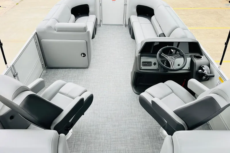 Slide: The Image of 2026 Sun Tracker Party Barge 22 DLX interior with spacious seating and modern helm. - 15