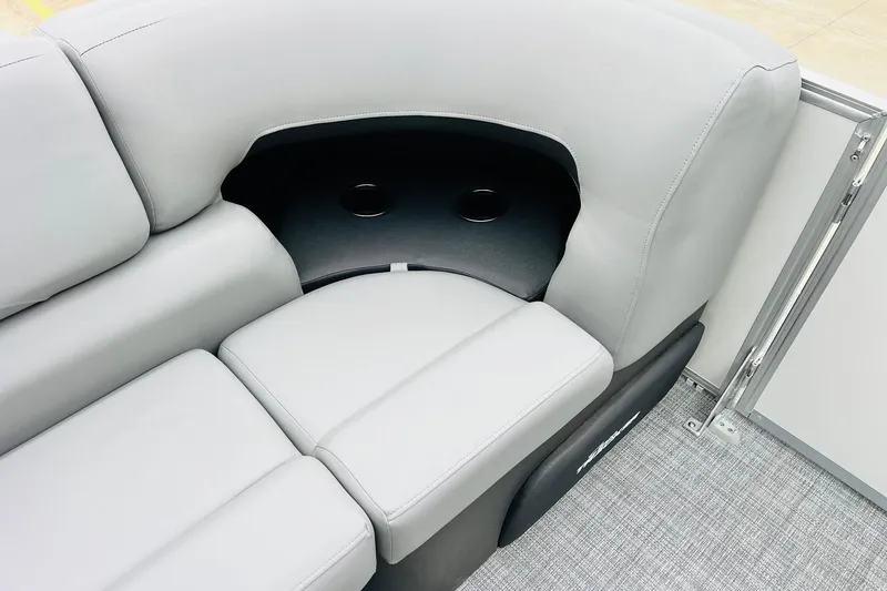 Slide: The Image of 2026 Sun Tracker Party Barge 22 DLX, gray seating with cup holders. - 23