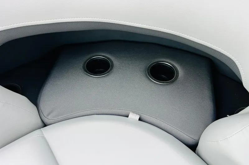 Slide: The Image of 2026 Sun Tracker Party Barge 22 DLX seating with integrated cup holders. - 29