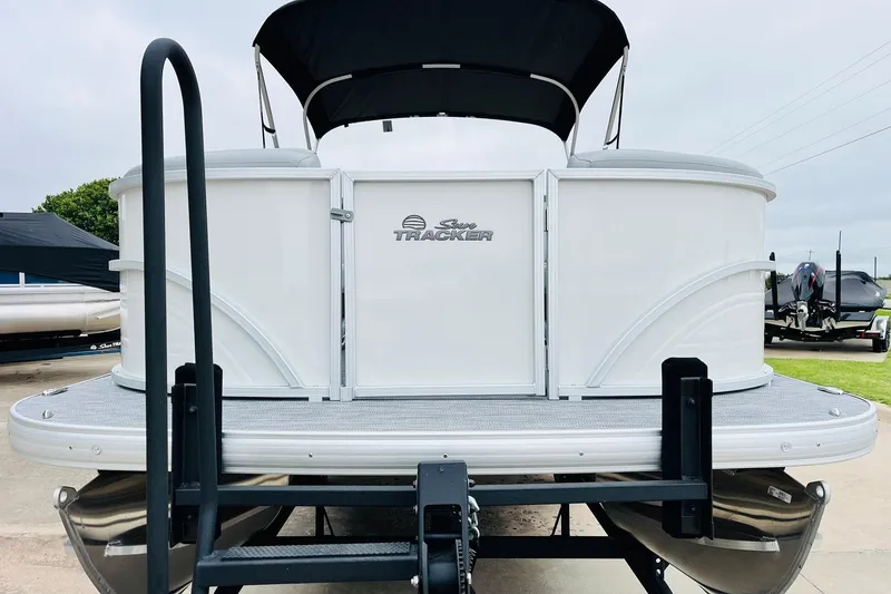 Slide: The Image of 2026 Sun Tracker Party Barge 22 DLX pontoon boat, rear view with canopy. - 3