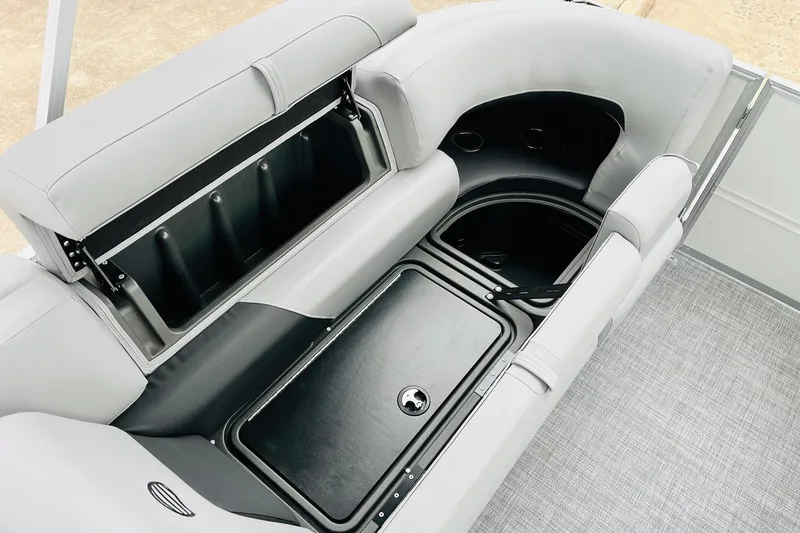 Slide: The Image of 2026 Sun Tracker Party Barge 22 DLX interior storage compartments and seating area. - 47