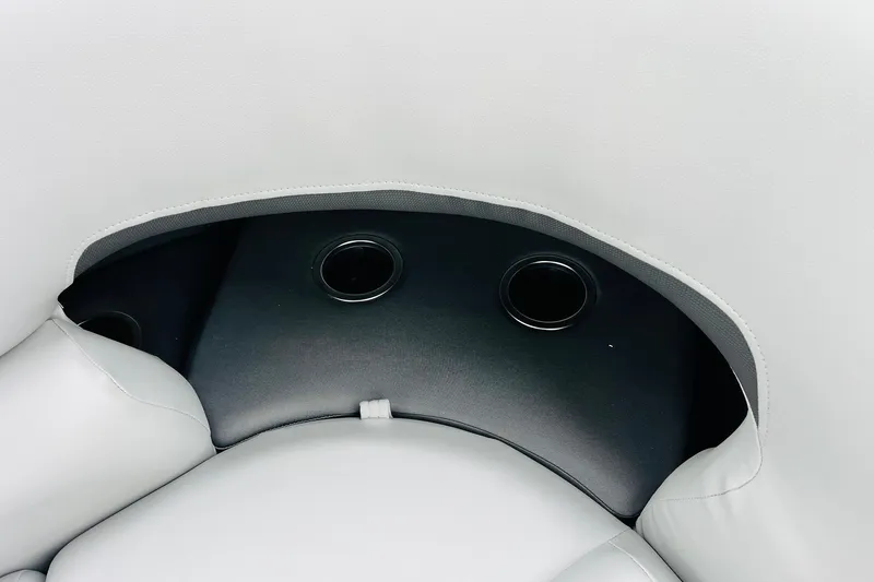 Slide: The Image of 2026 Sun Tracker Party Barge 22 DLX interior with cup holders and cushioned seating. - 48