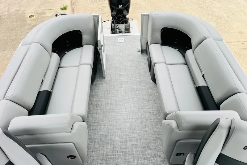 Slide: The Image of 2026 Sun Tracker Party Barge 22 DLX interior with gray seating and spacious layout. - 49