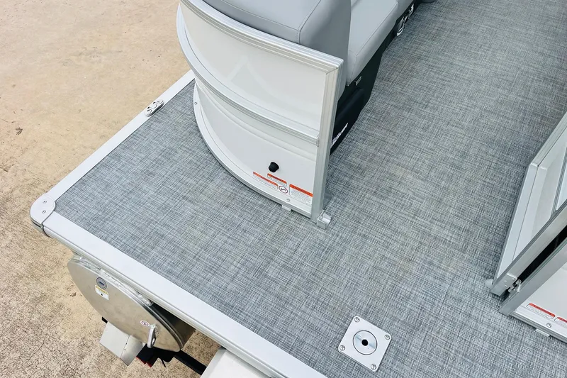 Slide: The Image of 2026 Sun Tracker Party Barge 22 DLX pontoon boat deck with gray flooring. - 50
