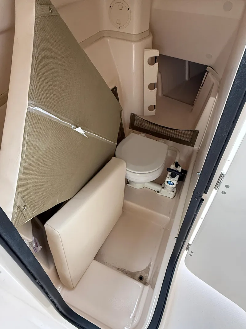 Slide: The Image of 2008 Grady-White Tournament 275 boat interior with compact marine toilet. - 3