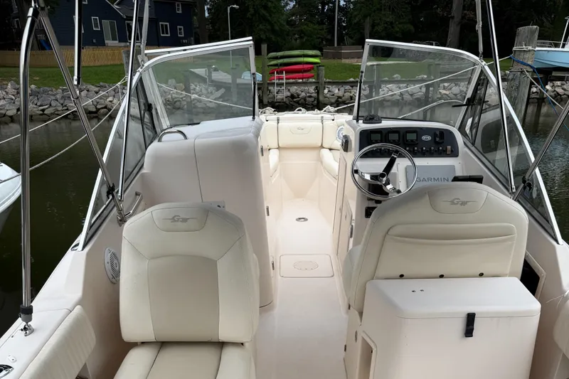 Slide: The Image of 2008 Grady-White Tournament 275 boat interior with steering wheel and seating. - 4