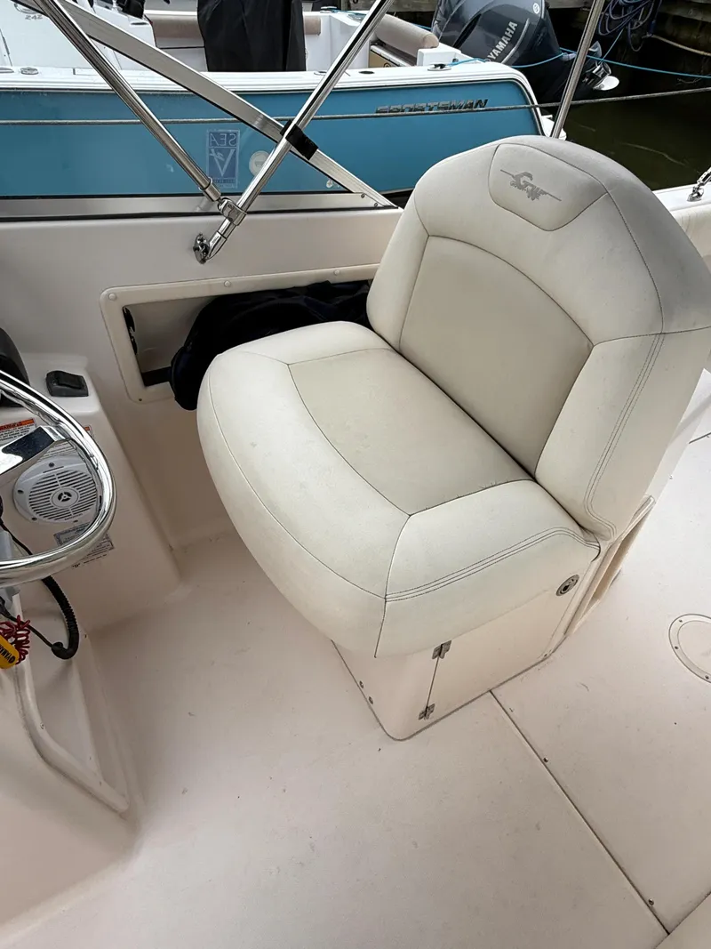 Slide: The Image of 2008 Grady-White Tournament 275 boat seat, white upholstery, and stainless steel railing. - 5