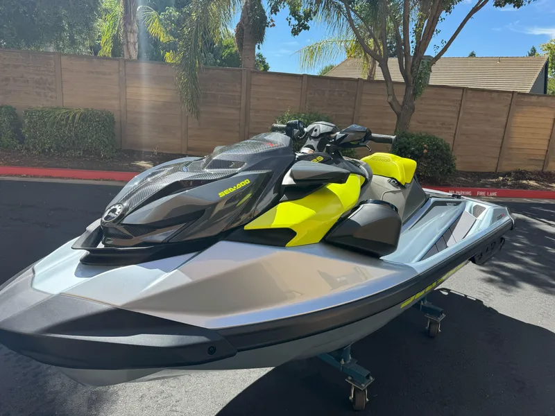Slide: The Image of 2025 Sea-Doo RXP-X 325 jet ski in a sunny outdoor setting. - 8