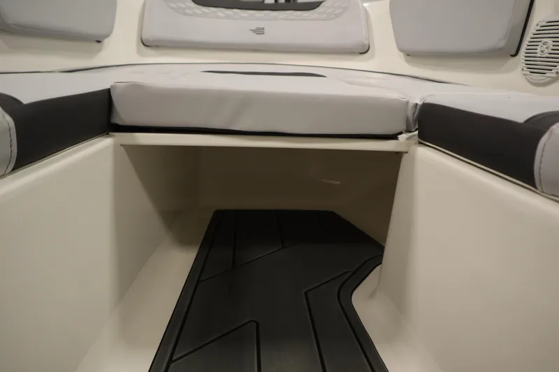 Slide: The Image of 2025 Bayliner M15 MX Comfort Package interior seating with storage space. - 13