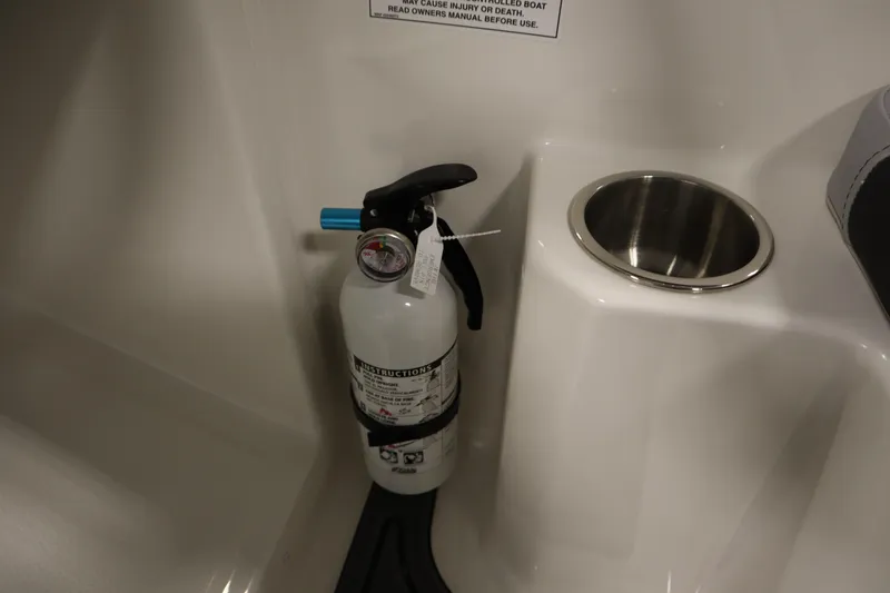 Slide: The Image of Fire extinguisher and cup holder on 2025 Bayliner M15 MX COMFORT PACKAGE boat. - 22