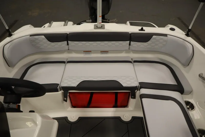 Slide: The Image of 2025 Bayliner M15 MX COMFORT PACKAGE boat interior with cushioned seating. - 24
