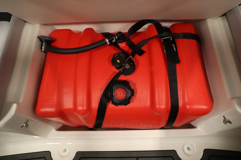 Slide: The Image of Red fuel tank in 2025 Bayliner M15 MX COMFORT PACKAGE boat storage compartment. - 25