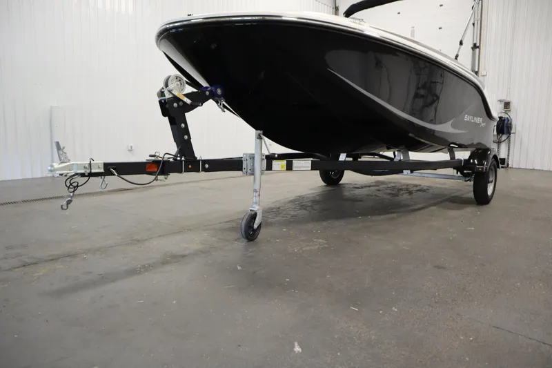 Slide: The Image of 2025 Bayliner M15 MX COMFORT PACKAGE boat on trailer in indoor setting. - 34
