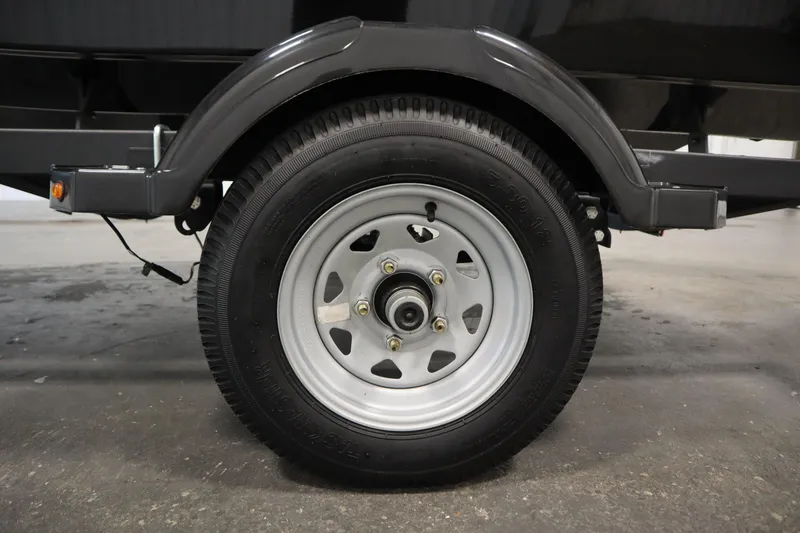Slide: The Image of Trailer wheel of 2025 Bayliner M15 MX COMFORT PACKAGE, close-up view. - 35