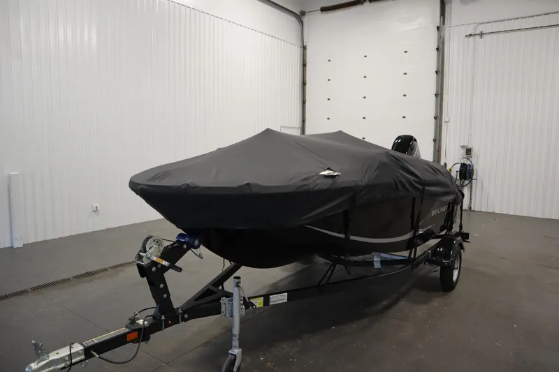 Slide: The Image of 2025 Bayliner M15 MX COMFORT PACKAGE boat covered in a garage on a trailer. - 36