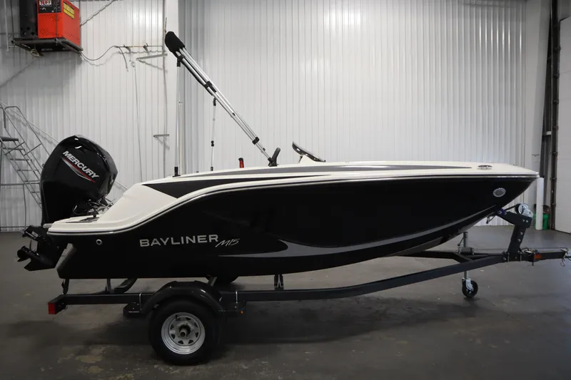 Slide: The Image of 2025 Bayliner M15 MX Comfort Package boat on trailer in indoor setting. - 4