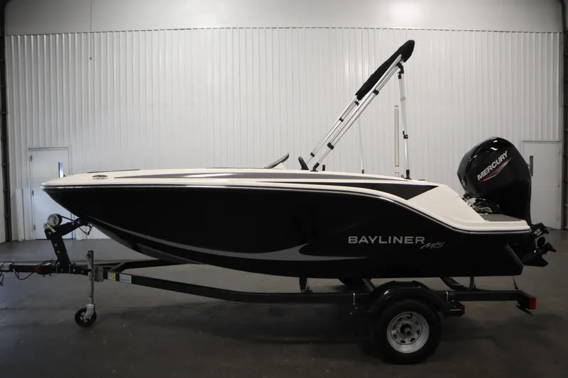 Slide: The Image of 2025 Bayliner M15 MX Comfort Package boat on trailer in indoor setting. - 8
