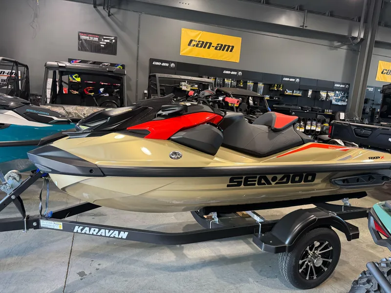 The Image of 2025 Sea-Doo RXP-X 325 jet ski on Karavan trailer in showroom. - 0