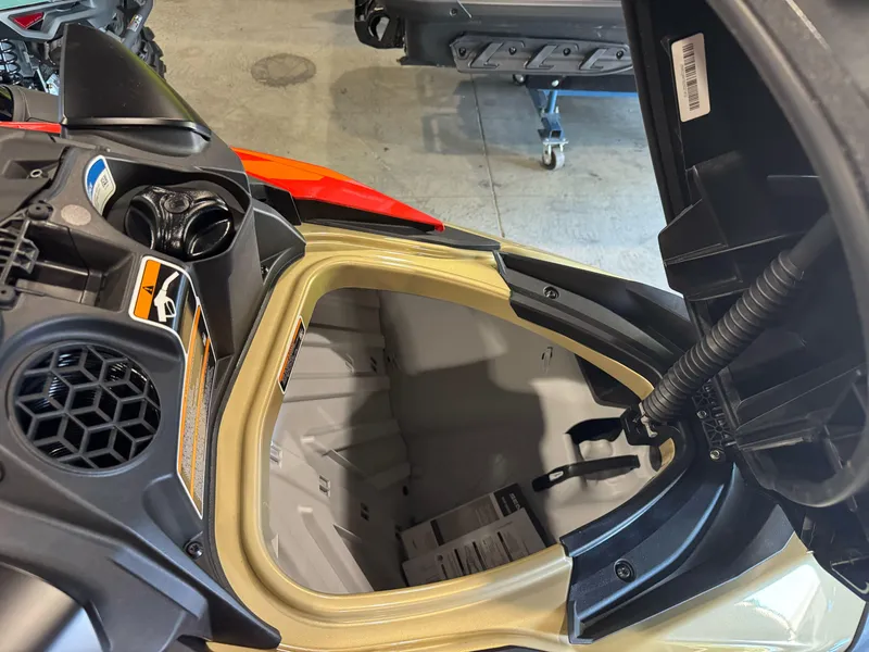 Slide: The Image of 2025 Sea-Doo RXP-X 325 storage compartment open, showcasing interior design. - 10