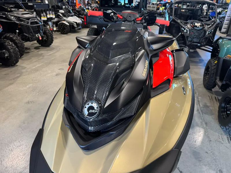 Slide: The Image of 2025 Sea-Doo RXP-X 325 jet ski in showroom, featuring sleek design and vibrant colors. - 2