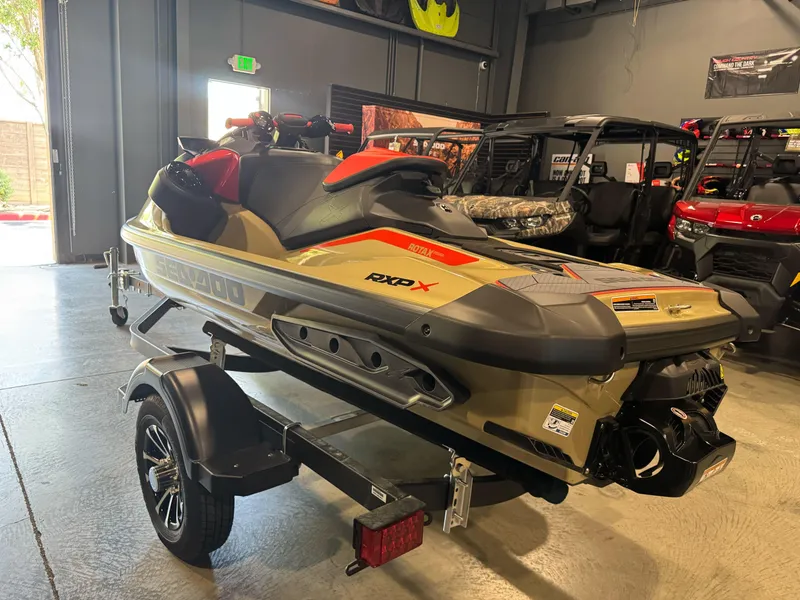 Slide: The Image of 2025 Sea-Doo RXP-X 325 jet ski on trailer in showroom. - 3