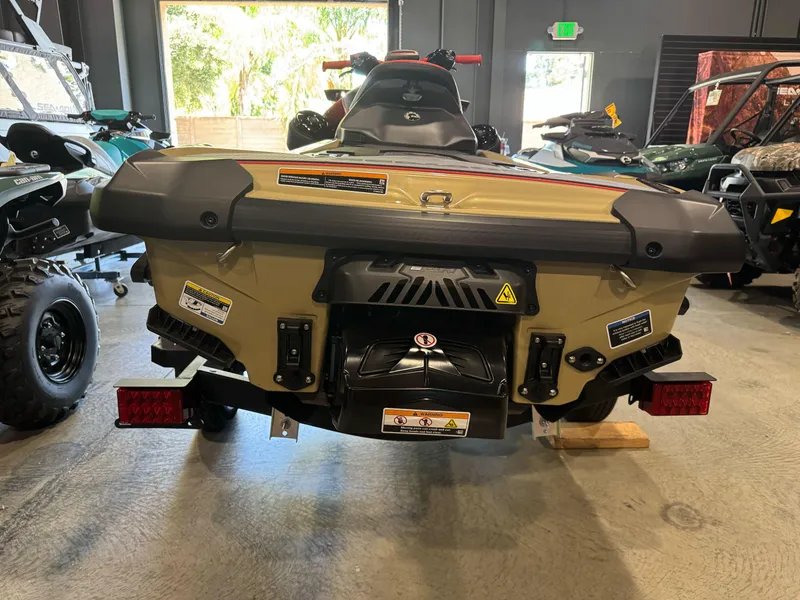 Slide: The Image of 2025 Sea-Doo RXP-X 325 jet ski rear view in showroom setting. - 4