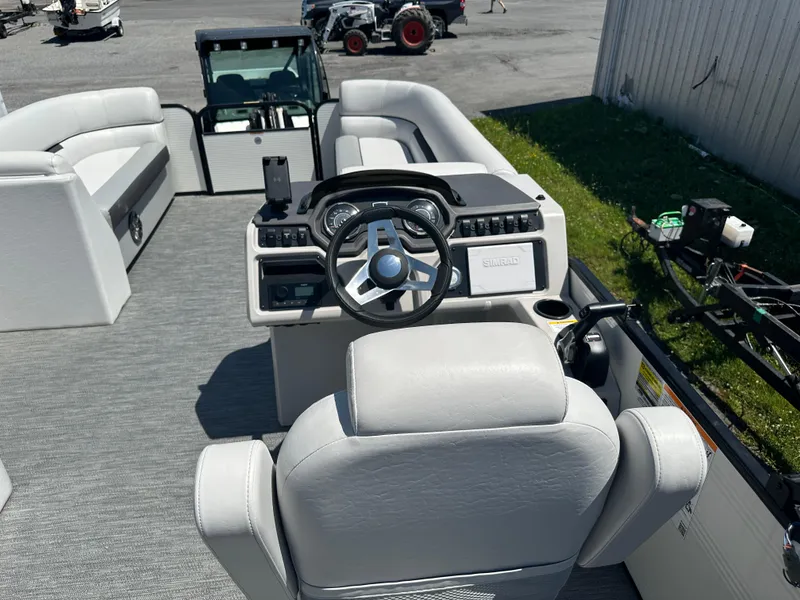 Slide: The Image of 2022 Godfrey SWEETWATER 2286 SFL boat interior with steering console and seating. - 8