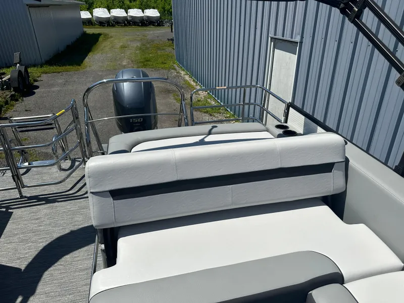 Slide: The Image of 2022 Godfrey SWEETWATER 2286 SFL boat interior with seating and outboard motor. - 9