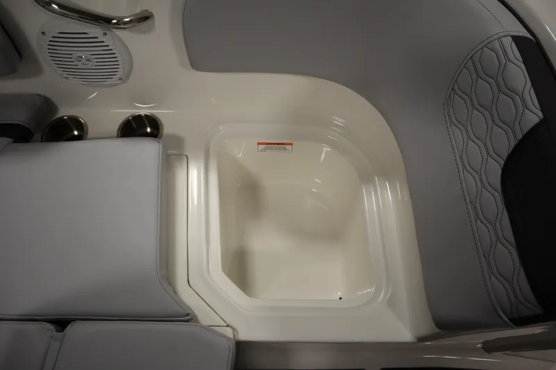 Slide: The Image of 2024 Bayliner M15 MX Comfort Package interior with cup holders and speaker. - 14