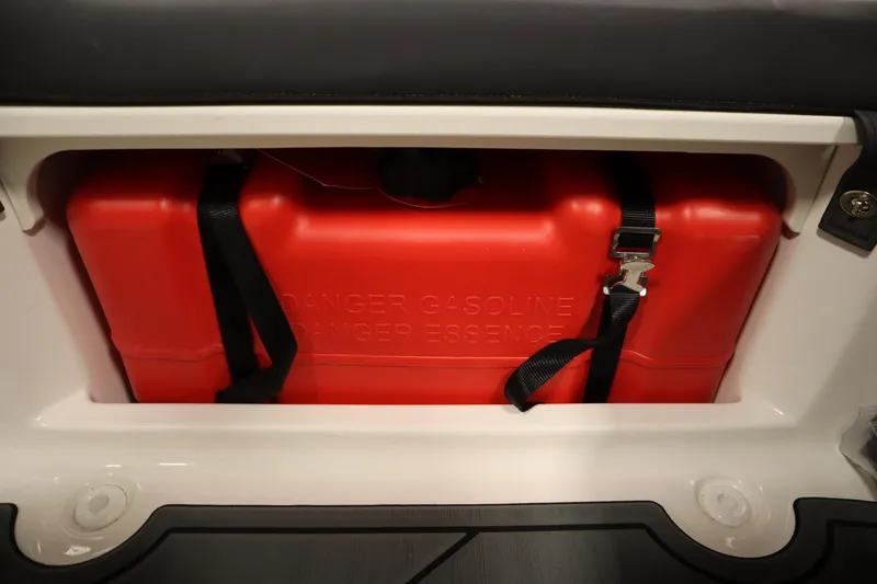 Slide: The Image of Red gasoline tank in 2024 Bayliner M15 MX Comfort Package boat storage compartment. - 23