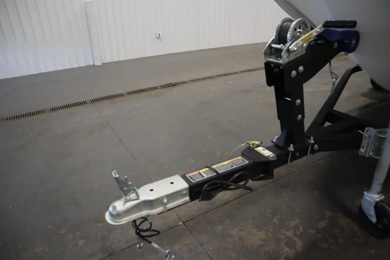 Slide: The Image of Trailer hitch of 2024 Bayliner M15 MX COMFORT PACKAGE in a garage setting. - 30