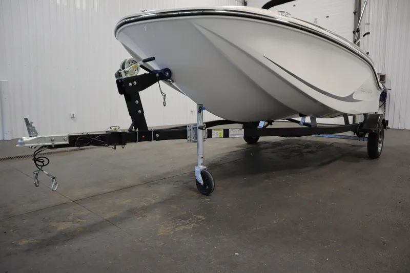 Slide: The Image of 2024 Bayliner M15 MX COMFORT PACKAGE boat on trailer in indoor setting. - 31