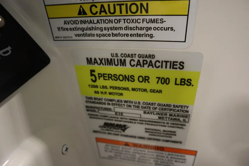 Slide: The Image of 2025 Bayliner Element M15 boat interior with cushioned seating and storage compartment. - 21