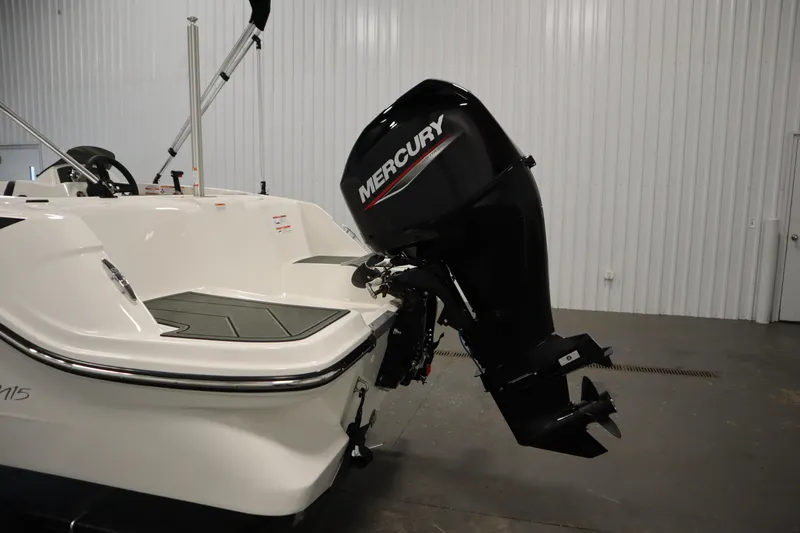 Slide: The Image of 2025 Bayliner Element M15 boat with rear ladder in a garage setting. - 27