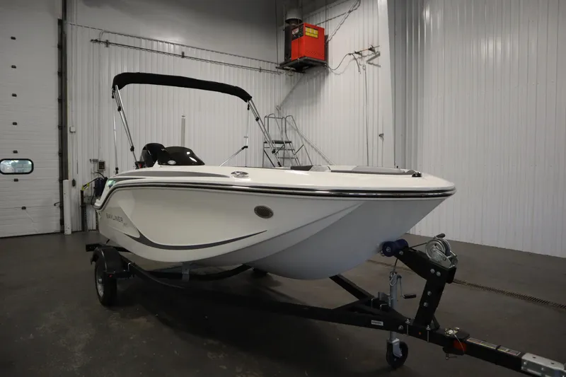 Slide: The Image of 2025 Bayliner Element M15 boat with Mercury engine in a garage setting. - 3