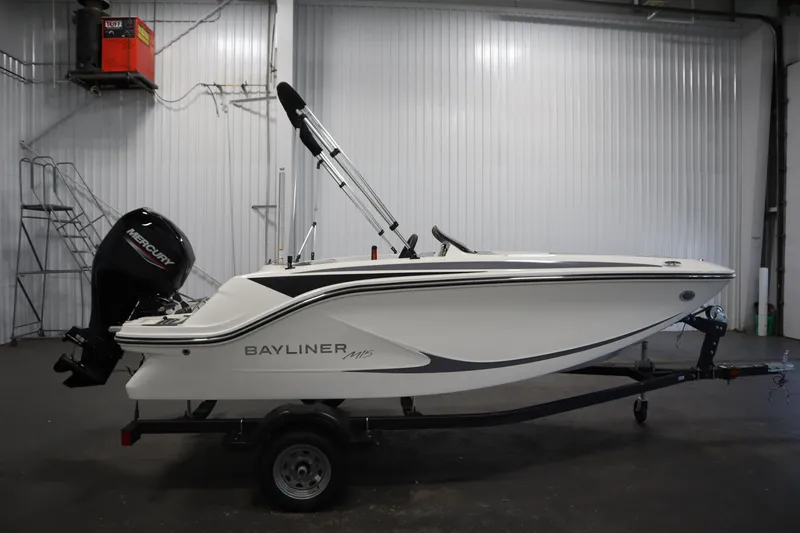 Slide: The Image of 2025 Bayliner Element M15 boat on trailer in indoor storage facility. - 4