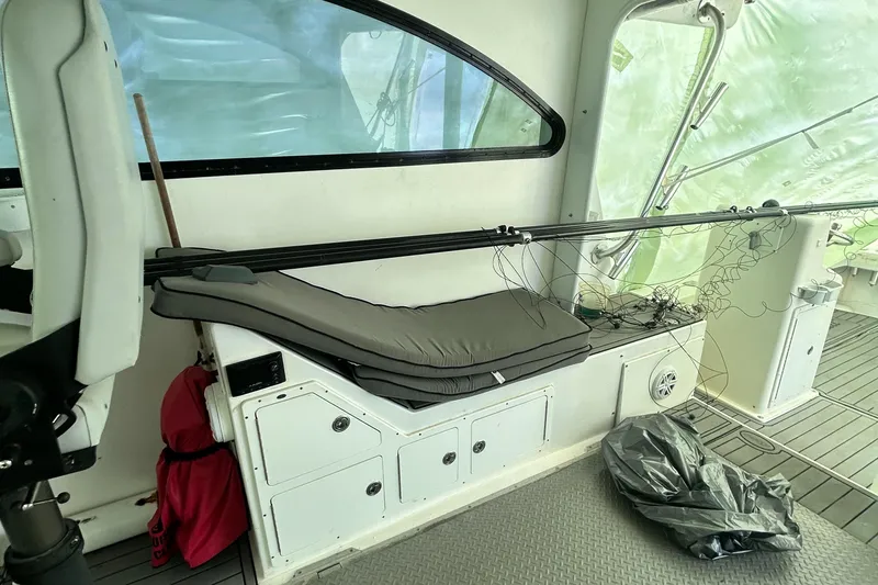 Slide: The Image of Interior of a 2016 Newton Sportfish boat with fishing rods and equipment. - 3