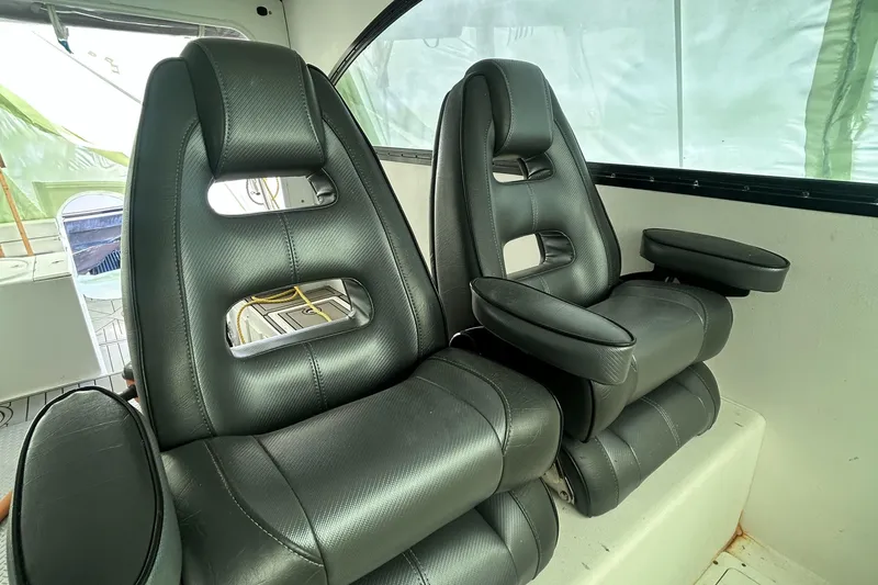 Slide: The Image of Luxurious black leather seats inside a 2016 Newton Sportfish boat. - 8