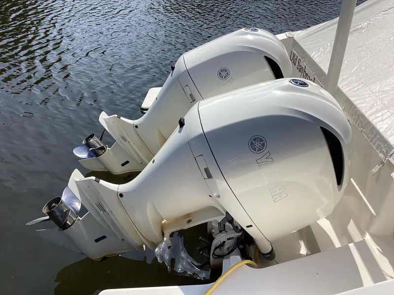 Slide: The Image of Twin Yamaha outboard engines on a 2017 Pursuit DC 325 Dual Console boat. - 34