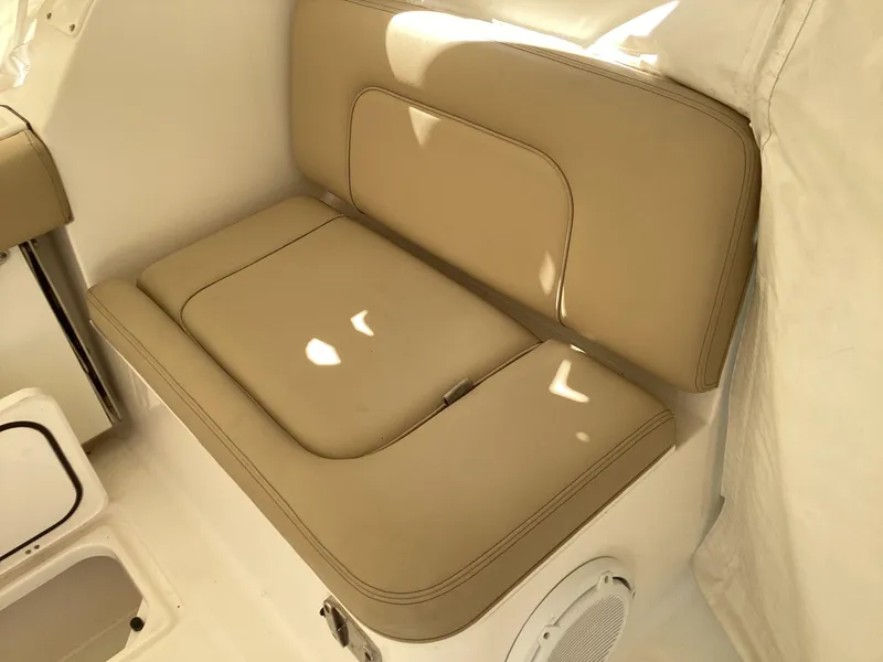 Slide: The Image of 2017 Pursuit DC 325 Dual Console boat interior with beige seating. - 37