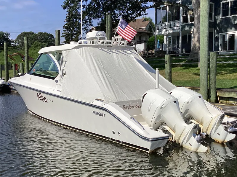 Slide: The Image of 2017 Pursuit DC 325 Dual Console boat docked with twin Yamaha engines. - 43
