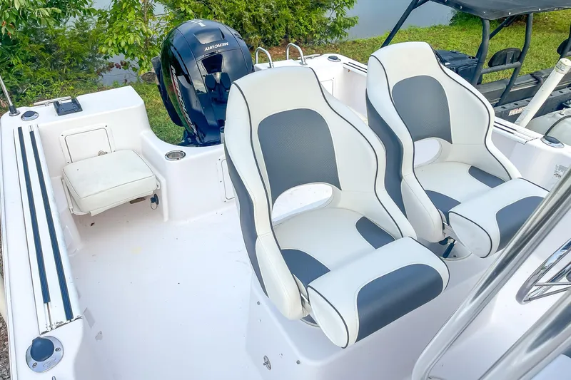 Slide: The Image of 2000 Pro-Line 20 Sport boat interior with dual seats and Mercury outboard motor. - 19