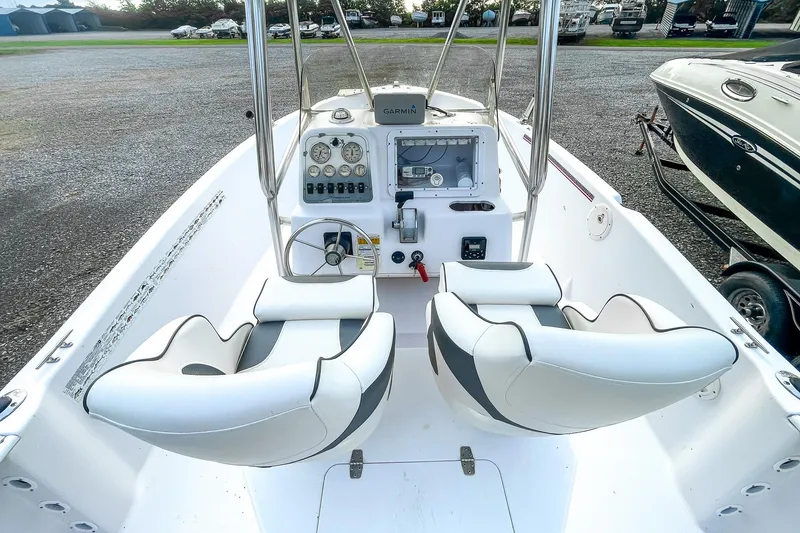 Slide: The Image of 2000 Pro-Line 20 Sport boat interior with dual seats and control panel. - 9